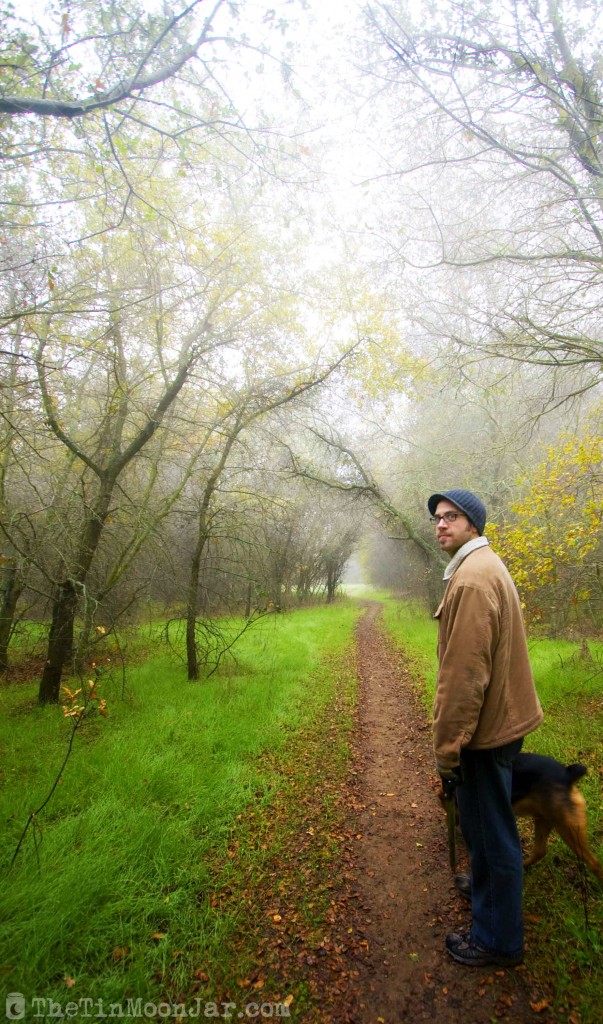 Man, dog, and fog on a spooky trail